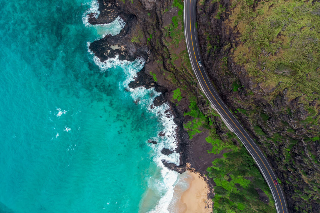 Aerial view of beach and road in Hawaii.