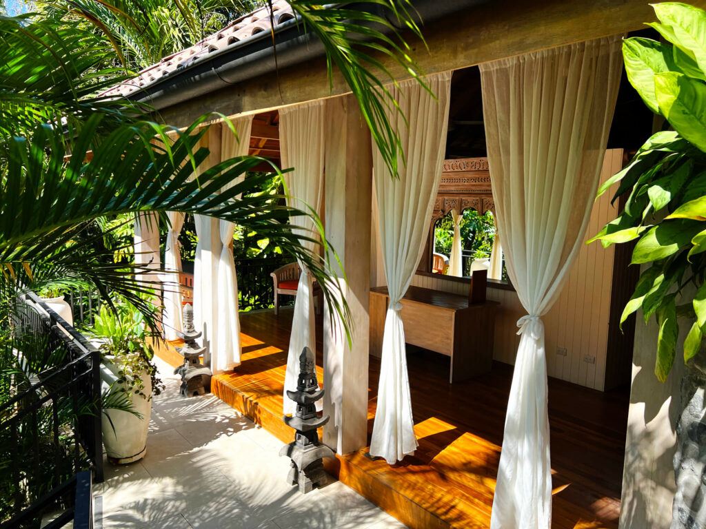 Palm trees and curtains at spa at Costa Rice resort.