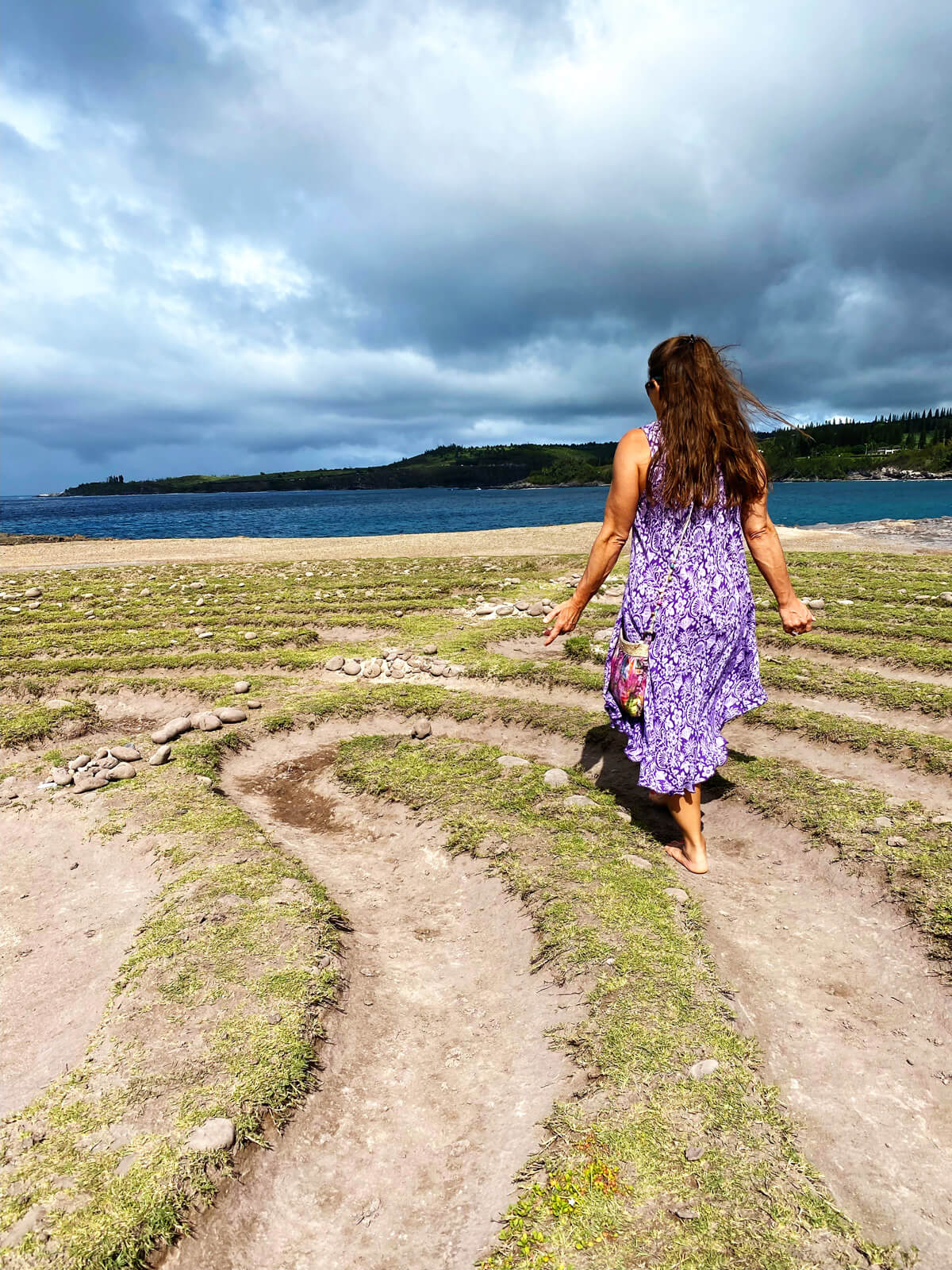 Woman walking in labyrinth.